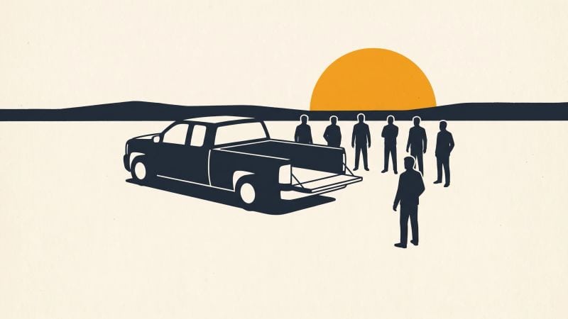 Crew silhouettes in a half circle at a lowered truck tailgate, one man facing them, sun low over the jobsite