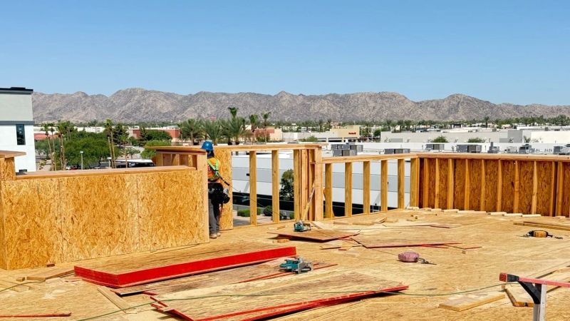 Fall protection (guardrail, PFAS, or safety net) in place at ALL unprotected edges 6 ft or more above lower level